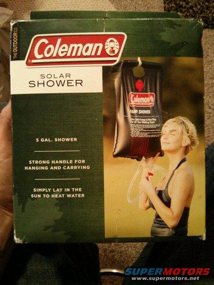 Coleman solar shower box with image of a woman holding the shower bag