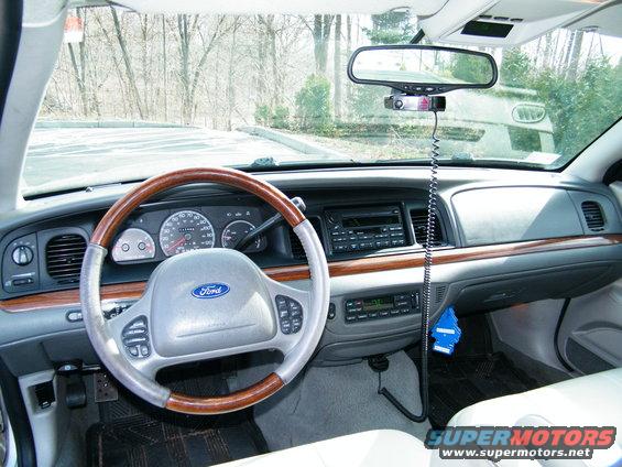 Interior of a 2004 Ford Crown Victoria, showing the dashboard, steering wheel, and center console