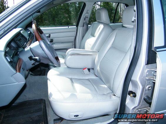 2004 Ford Crown Victoria interior showing light gray leather seats and dashboard