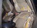 1993 Ford Probe - The interior of a car shows significant wear and tear on the tan seats.