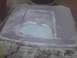 2003 Ford Crown Victoria - A car hood is being repaired with body filler and sanding.