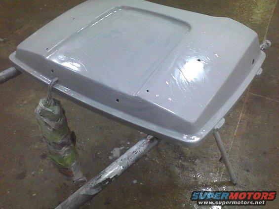 Gray hood part on stand