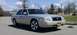 2008 Mercury Grand Marquis - A tan 2008 Mercury Grand Marquis is shown from the front three-quarter view on a sunny day.