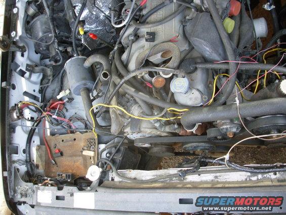 33int.jpg The yellow wire is temporary power from the aux. battery cable to the frame harness for the t/g window.