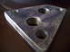 1993 Ford Probe - A close-up view of a metal plate with multiple threaded holes, likely a vehicle part.