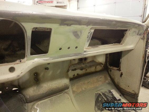1967 Ford F-100 dashboard stripped for restoration, showing empty gauge and radio openings