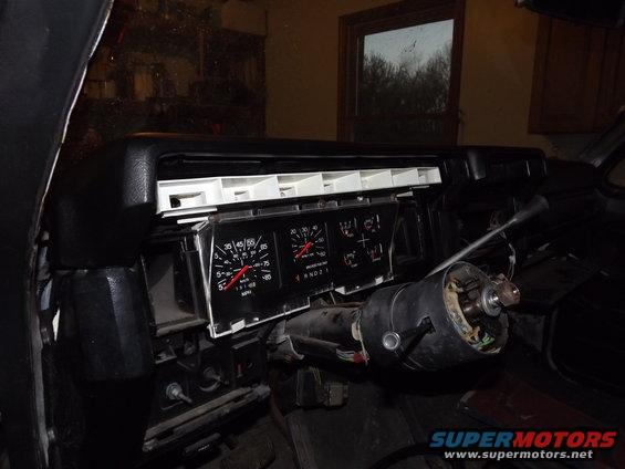 Dashboard with gauges removed, steering column visible