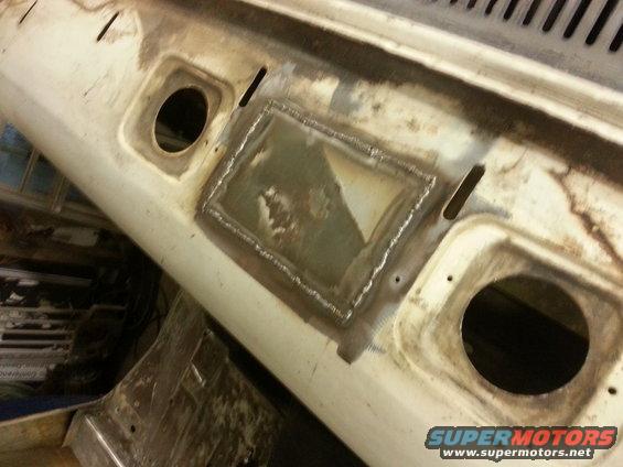 Welded patch on white 1967 Ford F-100 cowl panel