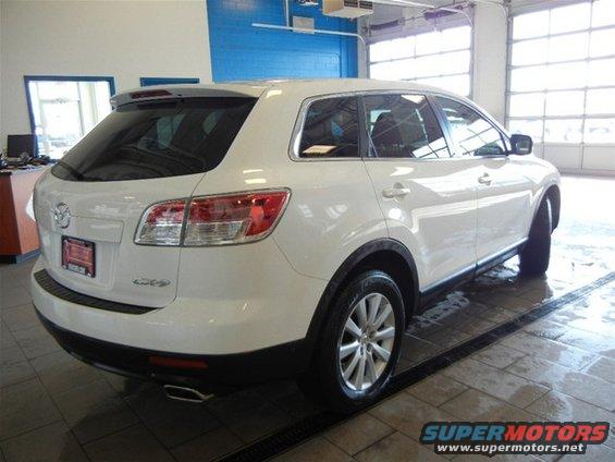 White 2008 Mazda CX-9 SUV rear quarter view, clean condition, parked indoors