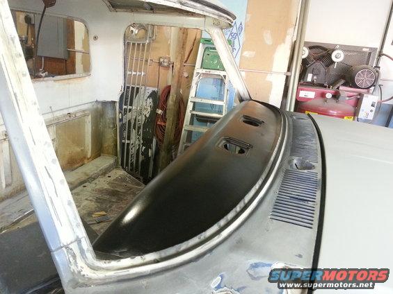 1967 Ford F-100 interior showing dashboard removed for work, with a ladder and air compressor in the background