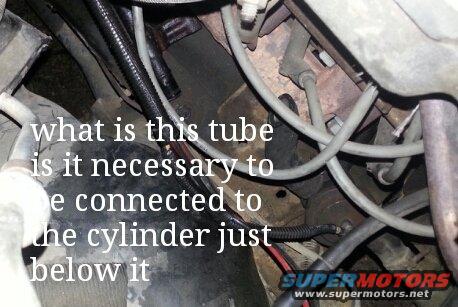 doris-parts1.jpg Im talking about the tube just above the "I" in this with the bracket attached to it approx. 2 " above the end. the cylinder im referring to is the one just to the right of the "t" in just. it has a hose that has been cut, what is this part and where does the hose go?