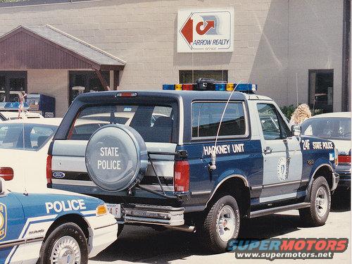 Ford Bronco with 'STATE POLICE' and 'HACKNEY UNIT' markings, parked next to another police car