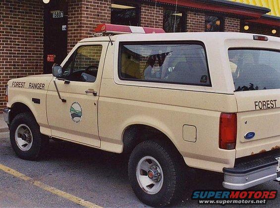 1994 Ford Bronco with 'FOREST RANGER' and 'FOREST' text, plus a Forest Service emblem on the door