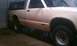 1991 Chevrolet S10 - This pickup truck, possibly a 1991 Chevrolet S10, is parked indoors and shows signs of wear and tear.