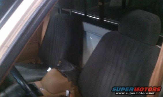 Interior view of a 1991 Chevrolet S10 pickup truck showing dark seats and dashboard