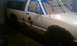 1991 Chevrolet S10 - Pickup truck side view, prepped for paint with masking tape and showing rust patches.