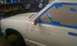 1991 Chevrolet S10 - Side view of a 1991 Chevrolet S10 with masking tape applied to the door and fender.