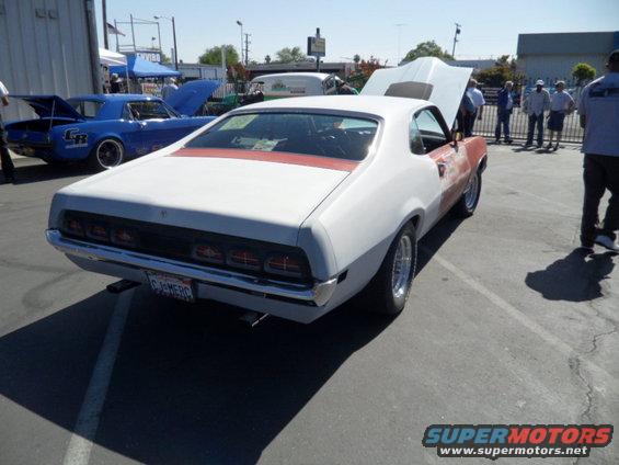 1970 Ford Ranchero with primer on front fender, red stripe on roof