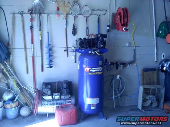 Garage scene with tools and air compressors