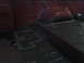 1978 Ford Bronco - The interior floor of a red vehicle shows areas treated with gray sealant.