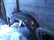 1978 Ford Bronco - Detail of the wheel well area, showing exposed metal and repair work.