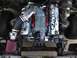 2004 Ford Crown Victoria - Engine bay view of a supercharged V8 motor with custom intake and air filter components.