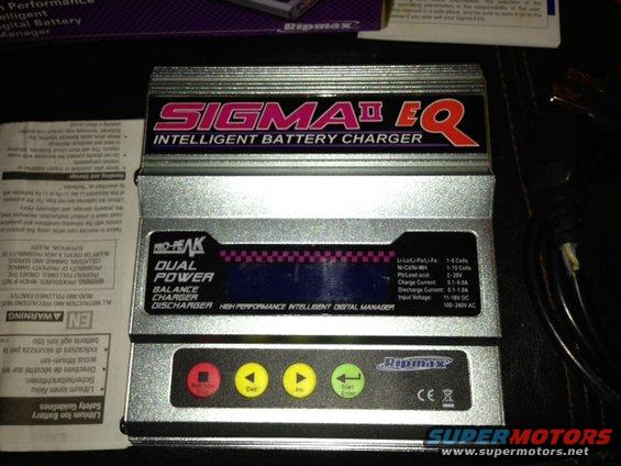 Pro-Peak Sigma II EQ intelligent battery charger with dual power balance charger and discharger functions. Buttons for stop, dec, inc, and start/enter