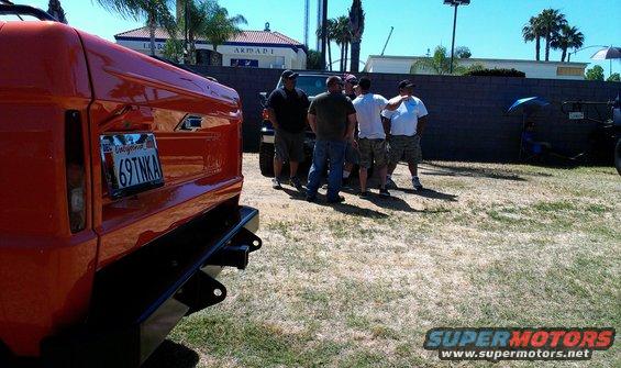 Orange SUV rear bumper and California license plate 69TNK A