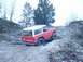 1992 Ford Bronco - This classic Ford Bronco is tackling a challenging off-road trail with steep inclines and loose rocks.