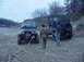 1992 Ford Bronco - Two Jeep Wranglers are in a dirt lot, one with a broken windshield, connected by a tow strap.