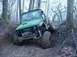 1992 Ford Bronco - A Suzuki Samurai navigates a challenging, muddy off-road course.