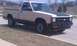 1991 Chevrolet S10 - This 1991 Chevrolet S10 pickup truck features a two-tone paint scheme with beige body and black accents on the hood and lower trim.