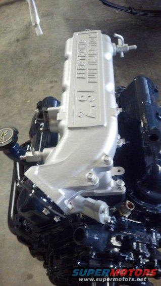 Engine intake manifold with "2.9L ELECTRONIC FUEL INJECTION" text