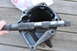 1974 Ford Bronco - A driveshaft is shown being held next to a differential housing, likely for repair or inspection.