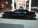 2000 Mercury Grand Marquis - Side view of a black 2000 Mercury Grand Marquis sedan at a gas station, captured at night.