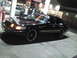 2000 Mercury Grand Marquis - A black 2000 Mercury Grand Marquis is seen from a three-quarter front angle at night.