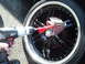 2000 Mercury Grand Marquis - Using a power tool to polish a custom car wheel.