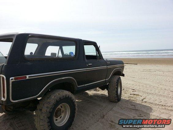 1979 Ford Bronco, black, 3q-front view, on a beach