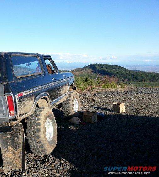 Black 1979 Ford Bronco, 3/4 front view, lifted with large tires