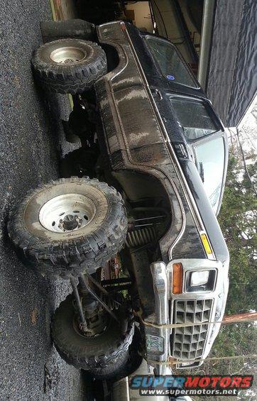 Black lifted Ford Bronco with large tires and custom grille