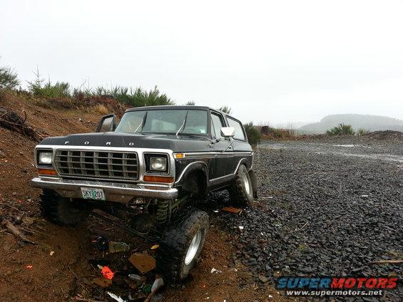 Black lifted Ford Bronco on a dirt and gravel road