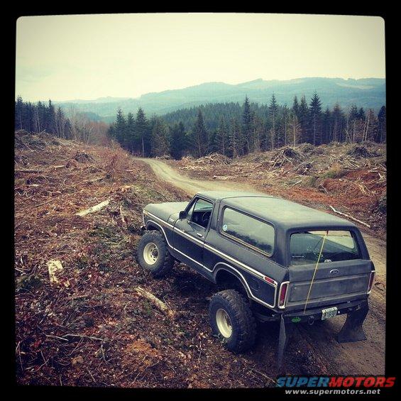 Black 1979 Ford Bronco 3q-front view on a dirt road
