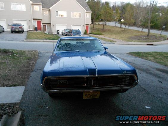 Blue 1968 Mercury Cougar front view with chrome grille and yellow license plate