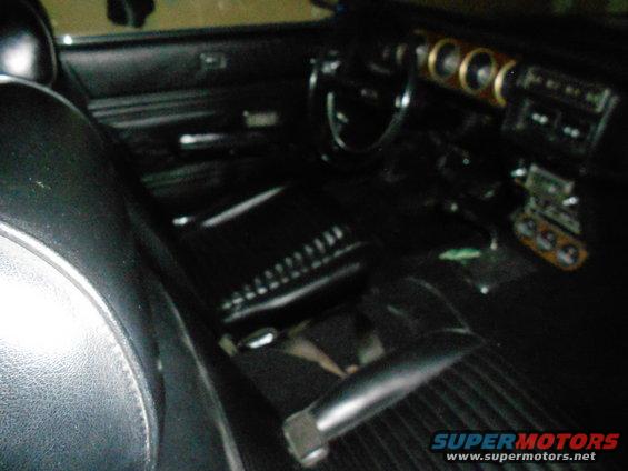 1968 Mercury Cougar interior showing black seats, dashboard with gauges, and steering wheel