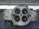 1995 Ford Bronco - This four-barrel carburetor features a top-down view, highlighting its four intake bores and visible casting numbers.