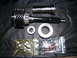 2004 Ford Crown Victoria - Transmission parts laid out, including gears, bearings, and fasteners.
