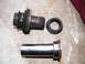 2004 Ford Crown Victoria - These automotive parts appear to be related to a vehicle's suspension system, possibly a bushing or bearing assembly.