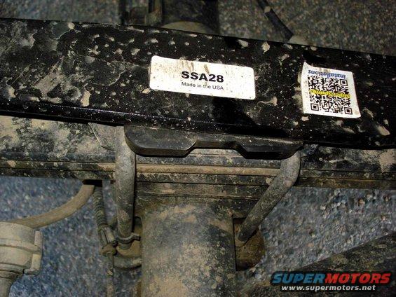Close-up of a black metal bar with a white label reading 'SSA28 Made in the USA' and a QR code