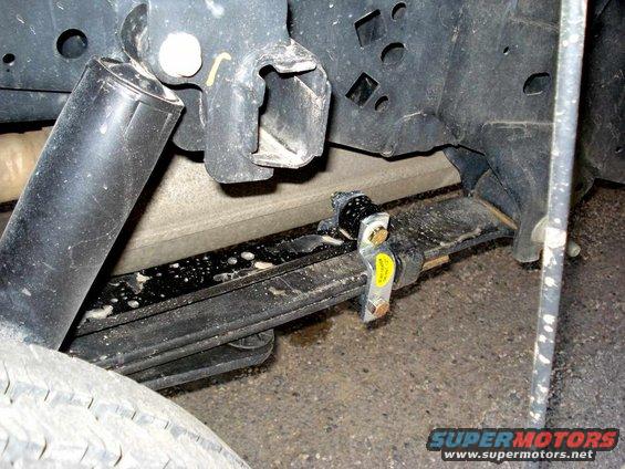 Rear leaf spring and shock absorber assembly