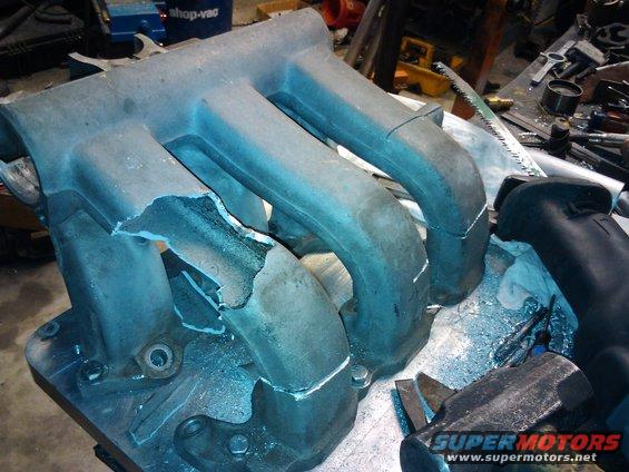 Damaged aluminum intake manifold with broken runners